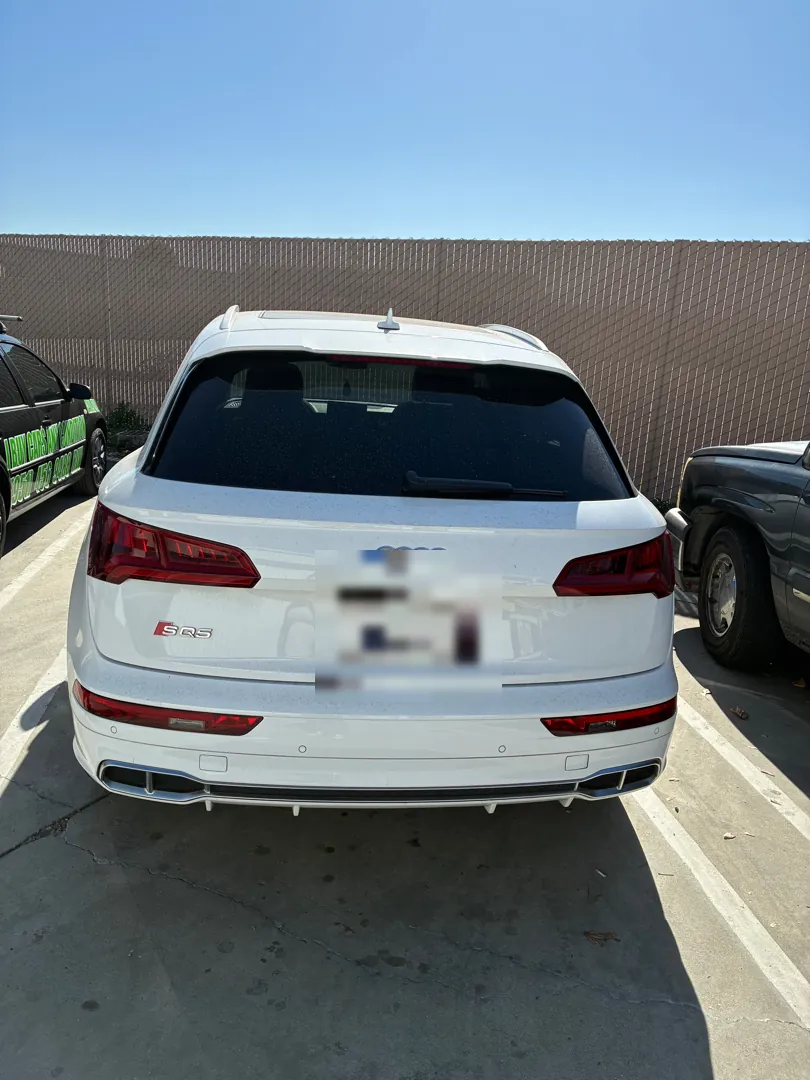 White Audi SQ5 parked at a repair shop before a timing chain replacement - Winchester, CA