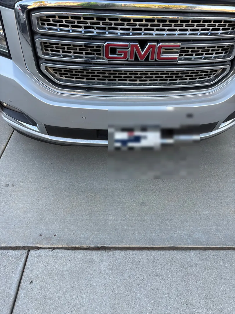 Front grille and bumper of a GMC Yukon XL photographed during a mobile inspection - Menifee, CA