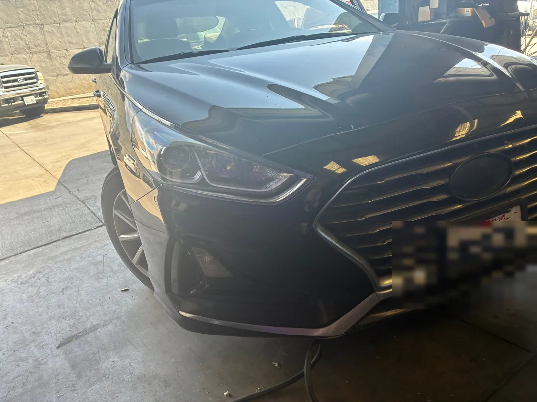Front view of a black Hyundai Sonata with diagnostic equipment cables running to it - Murrieta, CA