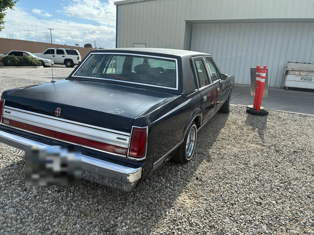 1988 Lincoln Town Car parked outside a garage before repair work - Perris, CA