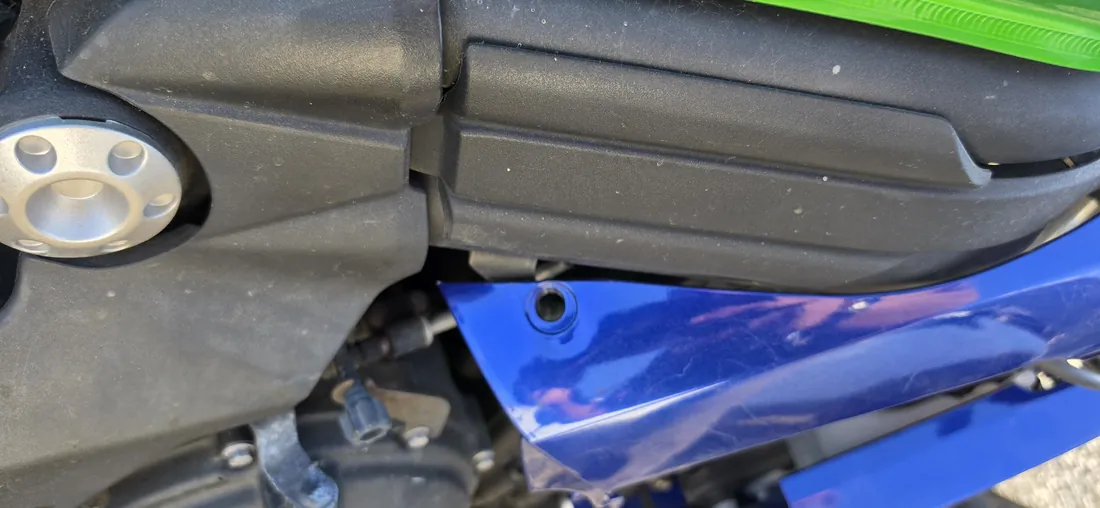 Exhaust heat shield and mid fairing panel on a Kawasaki sport bike during reassembly - Murrieta, CA