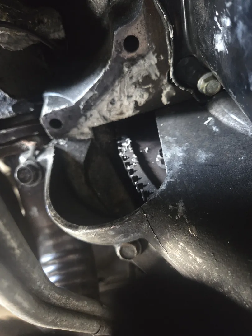 Starter motor mounting area on a bellhousing viewed from underneath a vehicle - Temecula, CA