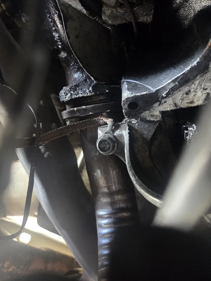 Tight clearance between the exhaust and starter motor on a vehicle undergoing starter replacement - Temecula, CA