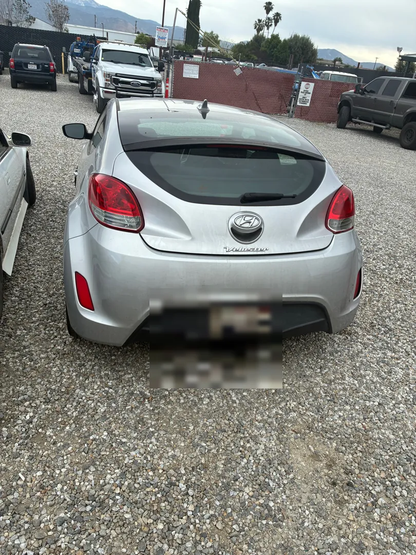 Rear view of a silver Hyundai Veloster during an electrical diagnostic - Menifee, CA